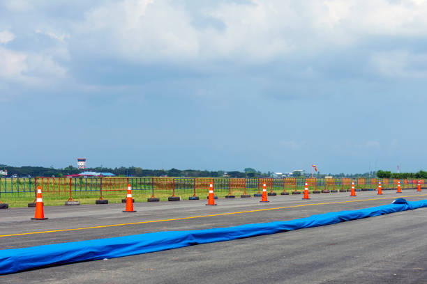 orange traffic cones and guardrails