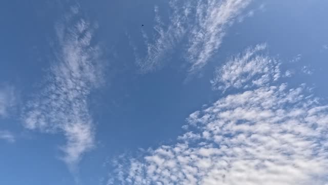 Serene Sky with Drifting Clouds