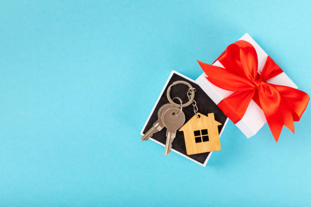 istock Plastic key ring in different colors with a place for a signature on a bright colored background. Bunch of keys with keychain. Mock-up keychain.Copy space.Concept for renting and selling real estate. 1959448851