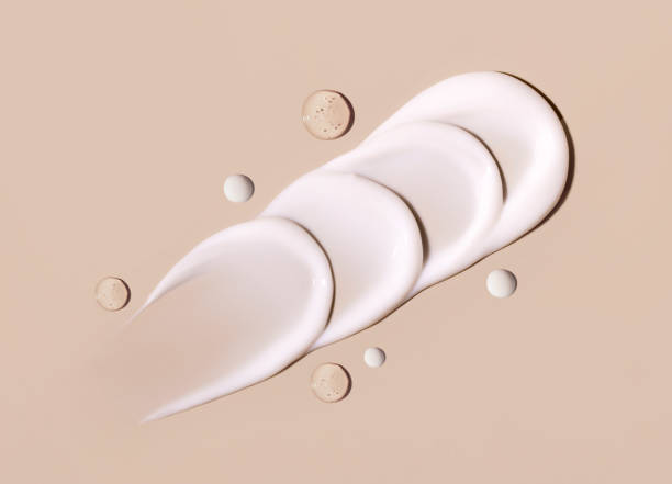 istock cosmetic smears texture on pastel beige background 1959451540