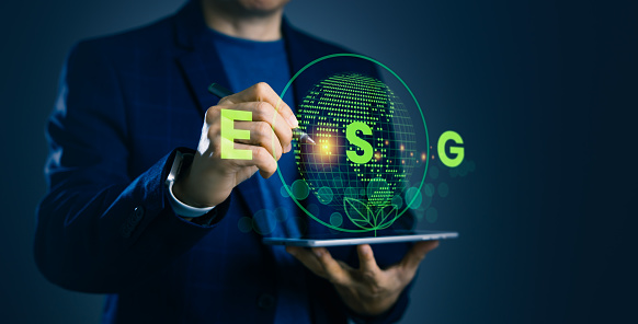 Man holds a tablet surrounded by ESG (Environment, Social, Governance) icons, eco-conscious investments, strategic management, and sustainable business practices