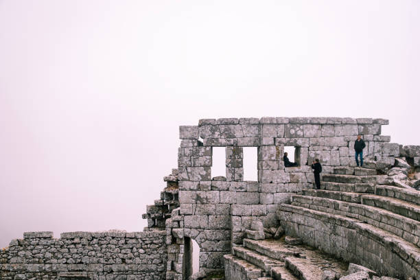 On a foggy winter day, people who came to visit the Ancient City of Termessos are exploring