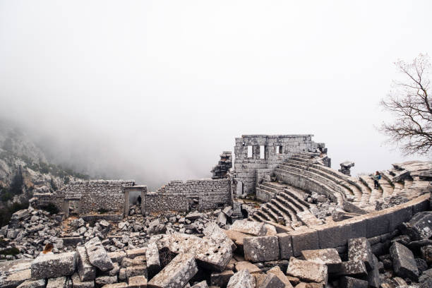 Termessos Ancient City theater under the fog Rediscovery of an old and abandoned ancient city termessos stock pictures, royalty-free photos & images