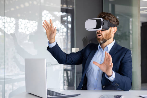 istock Professional businessman experiencing virtual reality headset in modern office, innovative tech concept 1959511719