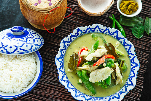 Asian Savory green curry chicken stir-fried with assortment of veggie dish with side dish rice