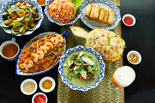 Overview of Assortment of delicious Thai cuisine at restaurant table