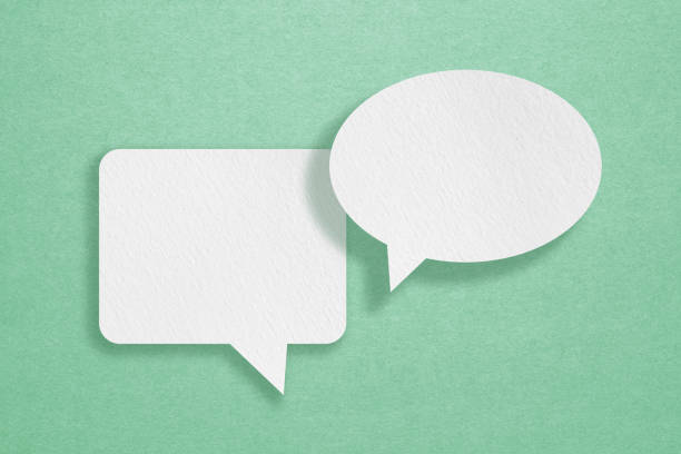 istock For conceptual image about communication and social media, customer feedback, Blank two white  grunge paper on rough green paper texture 1959533091