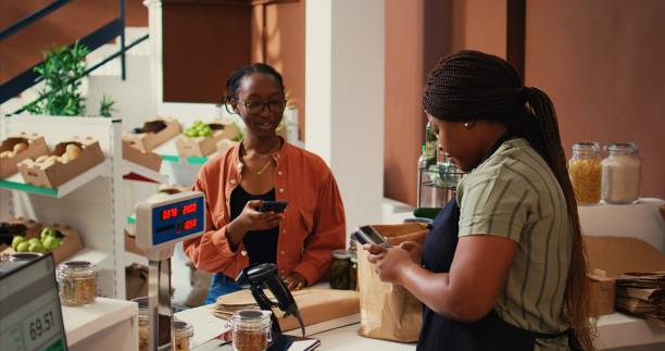 istock Client using nfc payment at pos to buy eco products 1959541717