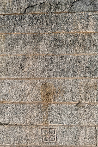 istock Beautiful decorative designs on the ancient stone wall 1959544968