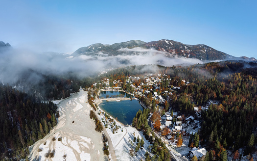 Aerial view of idyllic village by Lake Jasna near Kranjska gora in Slovenia on a cold autumn day