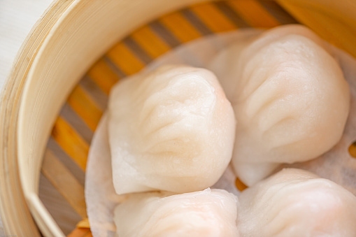 Close up of crystal shrimp dumpling in bamboo steamer