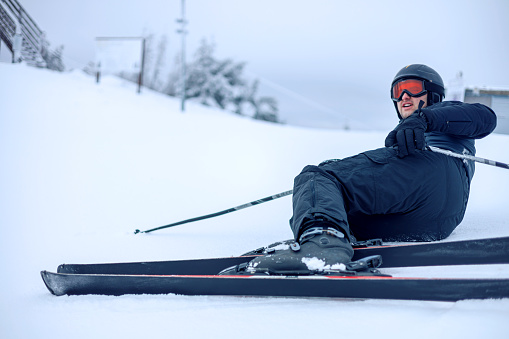 The cold wilderness poses an icy challenge as a skier encounters a slip-up on the snowy terrain, highlighting the need for skill and caution