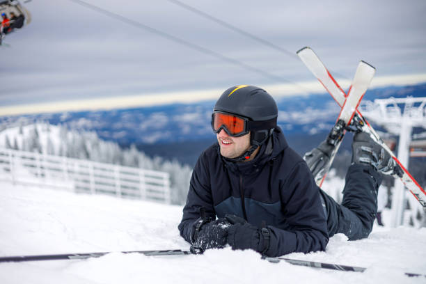 istock Men enjoying skiing in snowy mountains 1959584372