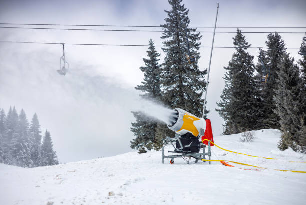 Amid the tranquil silence of a snow-laden landscape, a solitary snow groomer shapes a sports track, its trails a testament to the meticulous preparation behind the thrilling experience of downhill skiing, set against the vast, untouched beauty of a polar winter