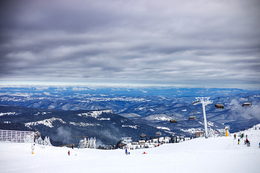 Kopaonik, Serbia-27 March, 2019: People on the mountain during winter season enjoying skiing and snowboarding with professional equipment during sunny day scenery.