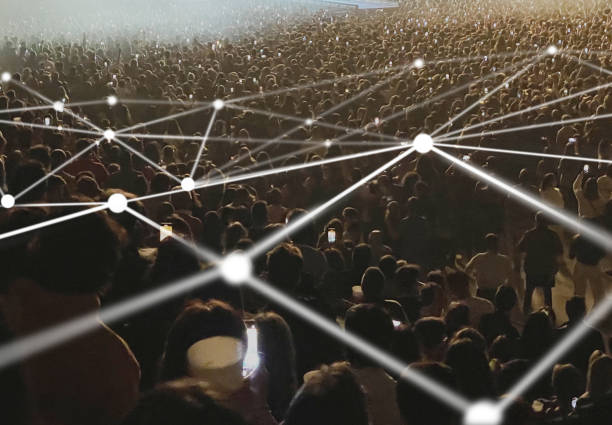 istock Crowd using cellphones at a concert connected by lines 1959598612