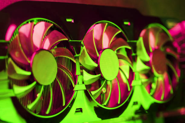 Powerful graphics card with three fans and a futuristic red-green neon backlight. High-tech GPU for gaming and mining of crypto farms