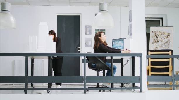 istock Real estate agency employees working on creative blueprints 1959624545