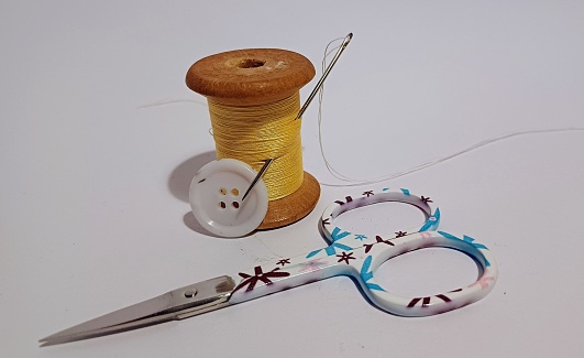 Needle and thread , scissors