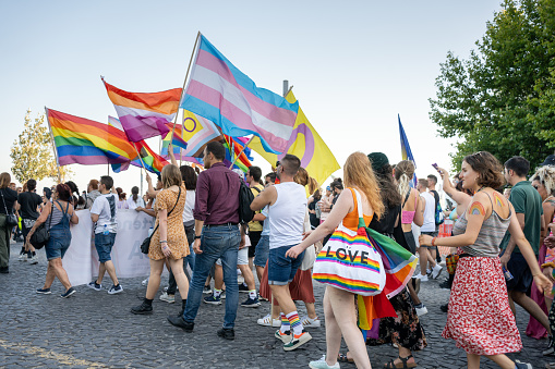 Lisbon, Portugal. 17 June 2023 Crowd of demonstrators walk and dancing on street during Pride Parade. People celebrate Gay Pride Parade in Lisbon. Happy and free people support of LGBTQ community