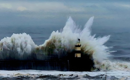 A lighthouse standing tall amidst crashing waves during a cloudy day on the ocean