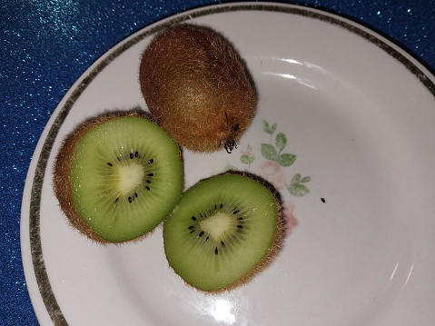 Fresh green kiwi fruit on a the plate