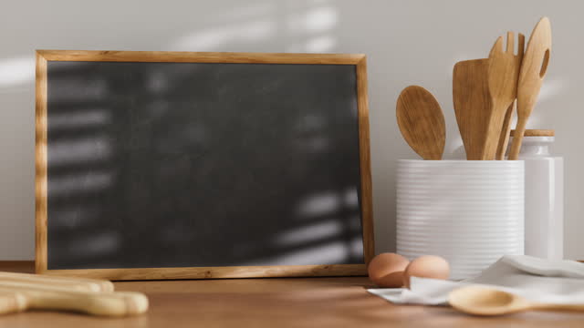Chalkboard in wood frame on the kitchen table, looping mockup