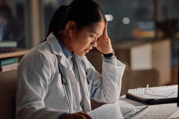 Woman, doctor and stress at night for deadline in lab for research proposal or problem solving, paperwork or burnout. Asian person, document and late decision for medicine review, diagnosis or report