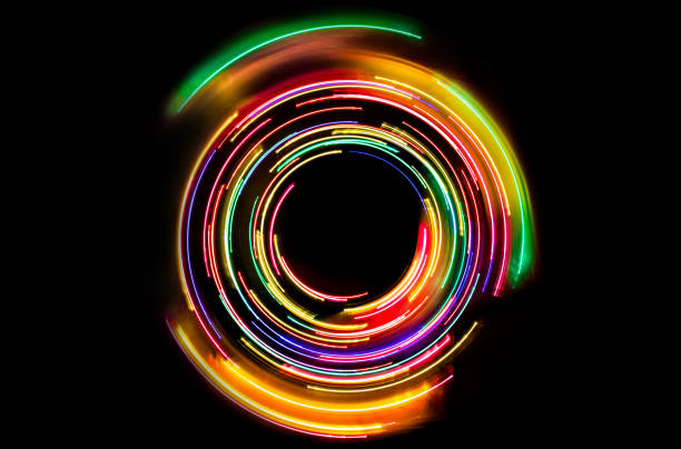 istock Abstract neon circle lines with empty copy space inside isolated on black background. 1959747932