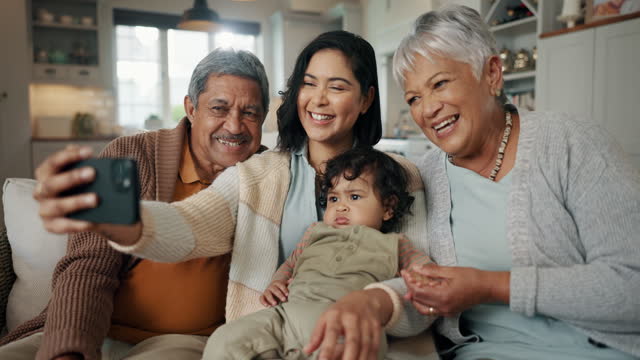 Selfie, woman and senior parents with baby bonding together on a sofa for relaxing at home. Happy, smile and female person taking a picture with elderly people and child in retirement in the lounge.