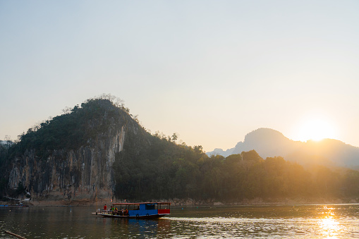 Boat near the pier of Mekong river at sunset