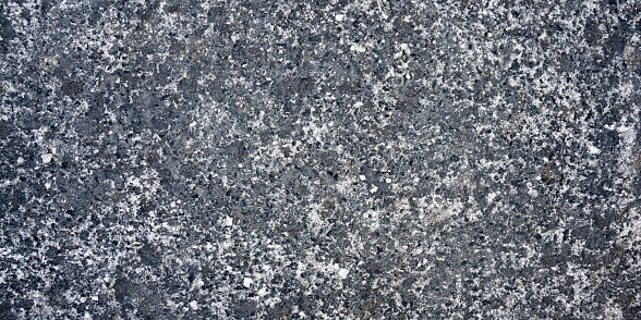Texture of a road surface. Natural background. Close-up. Selective focus.