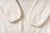 Textile natural wool white background. Clothes made from natural fabric.