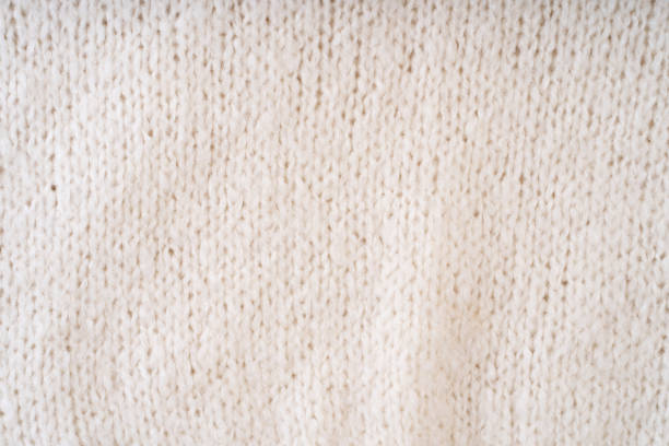 istock Textile natural wool white background. Clothes made from natural fabric. 1959784011