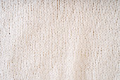 Textile natural wool white background. Clothes made from natural fabric.