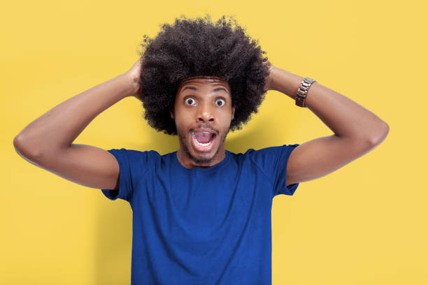 istock Surprised Afroamericano Man in Blue Shirt 1959803875