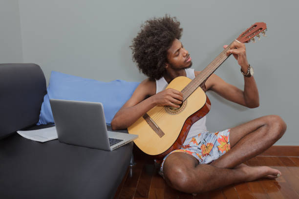 istock Strumming in Harmony: A Young Man's Musical Moment 1959806029