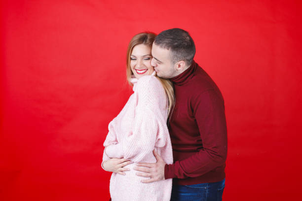 istock Young woman leaning on her boyfriend, he is hugging her from behind with affection 1959808154