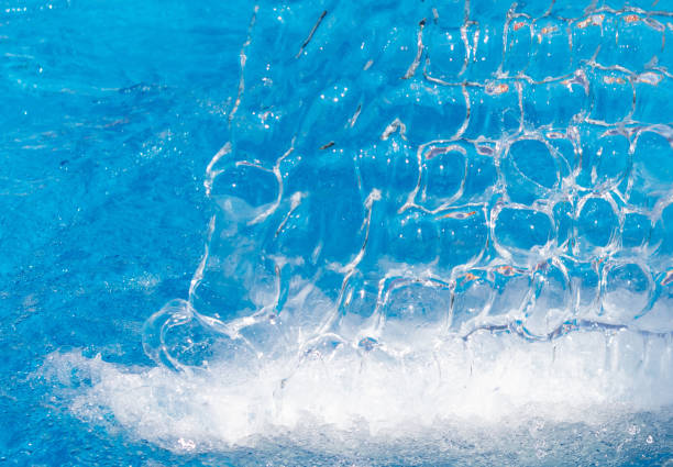 istock Splashes of water from a fountain as an abstract background 1959846549
