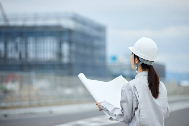 istock Japanese woman wearing work clothes working at a construction site 1959869845