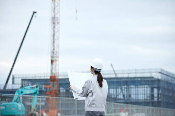 istock Japanese woman wearing work clothes working at a construction site 1959870151
