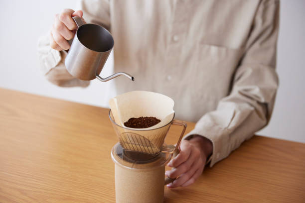 istock A woman's hand pouring coffee 1959872868
