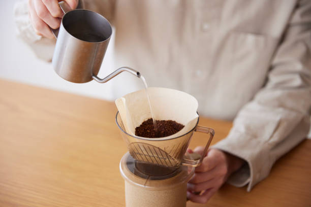 istock A woman's hand pouring coffee 1959872874