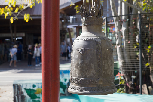 Large bell and log-sized mallet at Vietnamese Buddhist temple