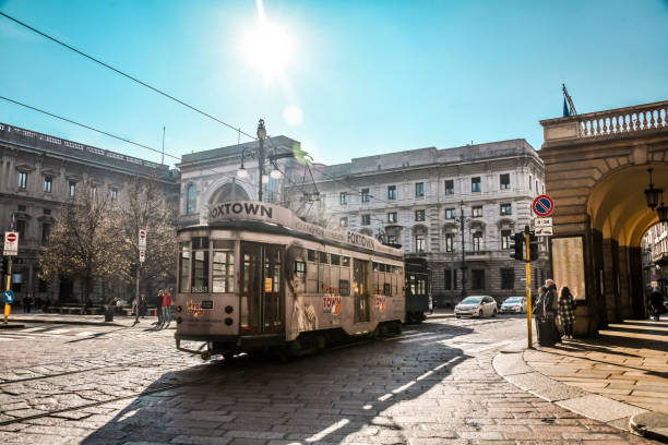 Tramway Near Piazza della Scala In Milan, Italy. Rear view of a tram about to cross the palace of the Banca Commerciale Italiana located at Piazza della Scala, pedestrian central square of Milan, Italy, connected to the main square of Milan, Piazza del Duomo.