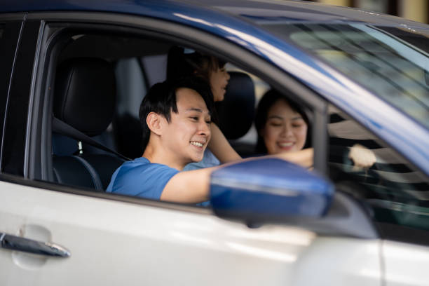 istock Happy family enjoying while going on a vacation by car 1959921966