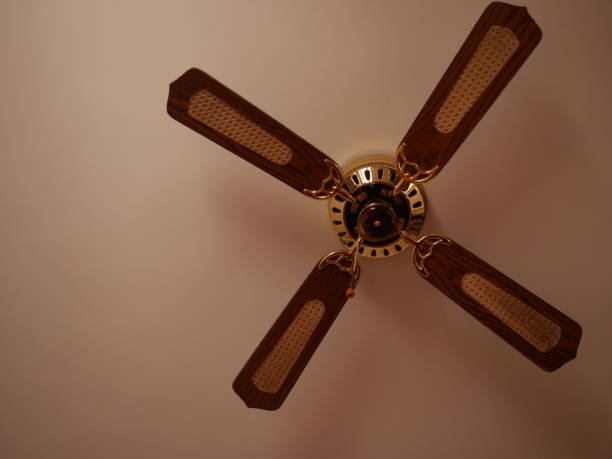 istock Ceiling fan. Creating air coolness on hot days. Dramatic cinematic atmosphere. Copyspace. Space for titles or text 1959935519