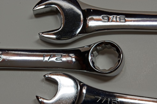 Open end and box end wrenches on white
