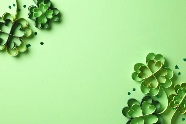 istock Flat lay composition for St Patricks Day with four-leaf paper art clover. Saint Patrick's Day background, banner design. 1959982290