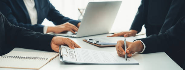 istock Two business executive discuss term and company merging agreement. Shrewd 1959982854